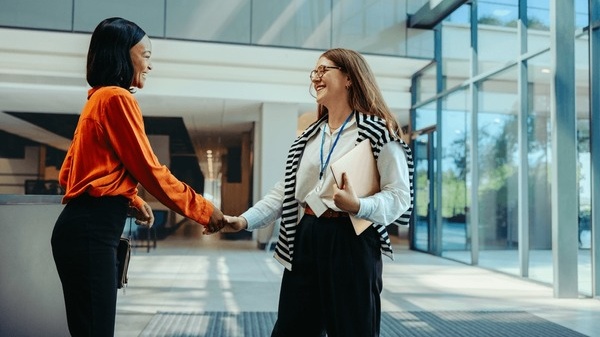 Professional woman welcoming gesture